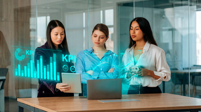 Analytical women reviewing KPI data on digital interface