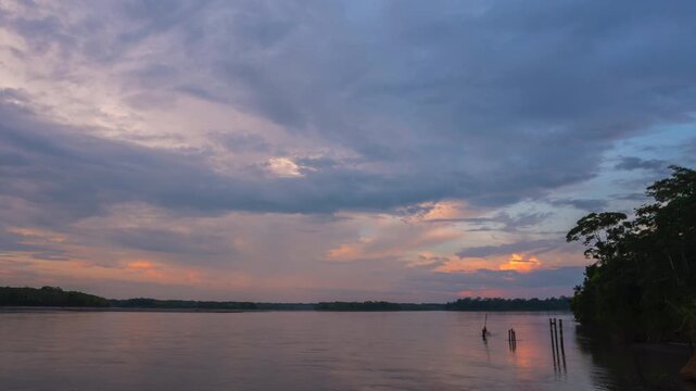 Rio Napo in the Ecuadorian Amazon, sunset timelapse. Rio Napo is a major tributary of the Amazon. At Pompeya Sur, Orellana province, Ecuador