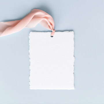 Handmade deckle edge paper tag with pink ribbon - perfect for branding, packaging design, and stationery presentations