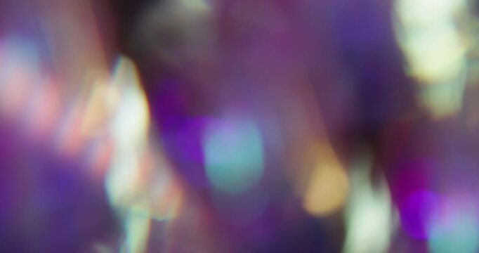 Light defocused overlay. Colorful glow. Faceted crystal diamond twinkle luminosity texture. Optical blue orange bokeh reflection background.