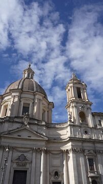 Roma, Italy. February 15, 2026, Stunning low angle view of the Sant'Agnese in Agone church revealing the Fountain of the Four Rivers by Bernini in Piazza Navona