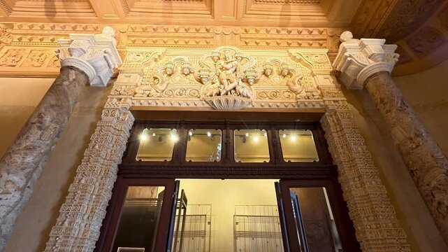 CAIRO, EGYPT - APRIL 25, 2026: Interior view showing the ornate architectural details, intricate ceiling carvings, and classical doorway of the historic Baron Empain Palace in Heliopolis.