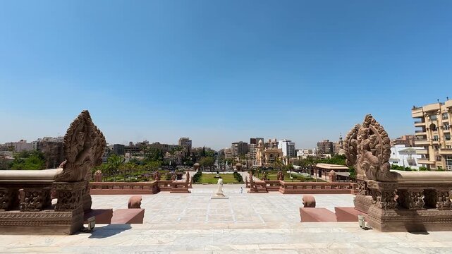 CAIRO, EGYPT - APRIL 25, 2026: Wide low-angle shot of the historic Baron Empain Palace exterior, showing the grand staircase, unique Hindu-inspired architecture, and the main tower in Heliopolis.