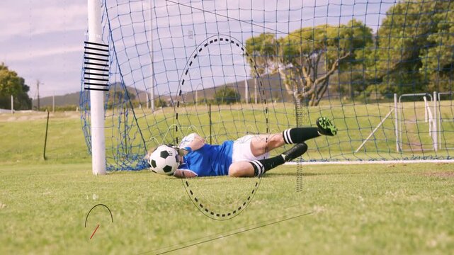 Soccer keeper shifting after ball entry, diving, catching ball with gloves, securing for next play