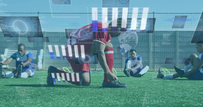 Kneeling player in red kit tying black cleat on turf, teammates in blue stretching, HUD overlay