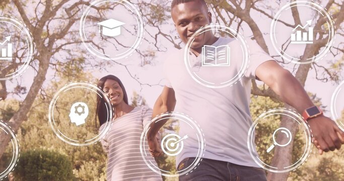 Smiling man walking toward camera in sunlit park, with floating infographic icons and smartwatch