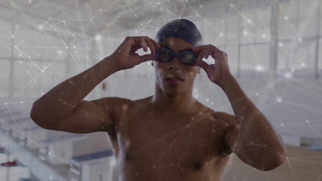 Vertical video: Swimmer pulling goggles tight, checking seal, dotted network overlay showing prep
