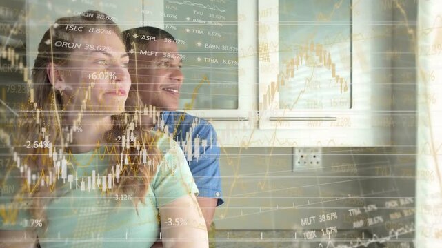 Couple at kitchen window, overlaid finance charts sparking woman turning and pointing, man smiling