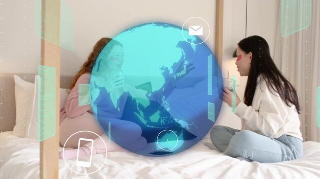 Two women holding cups, globe appearing between them, growing and revealing app icons for tech