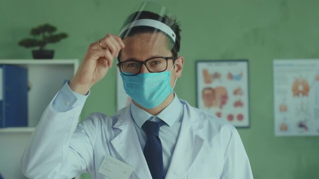 Medical practitioner carefully calibrates protective gear prior to patient examination in serene office setting