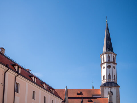 Tower of the Church of St. James in Levoca, Slovakia, with historic architecture and clear blue sky. Landmark of medieval town and UNESCO heritage region.