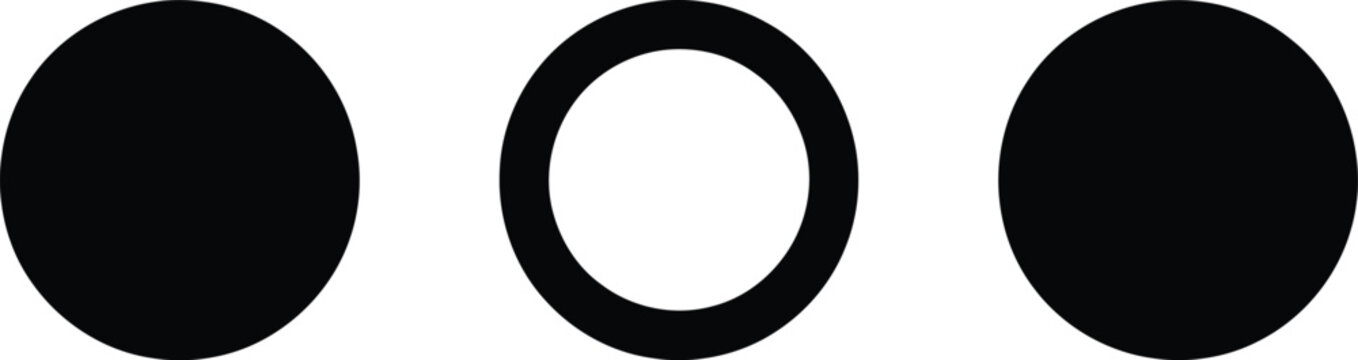 Three black circles, one with a white inner ring, on a white background