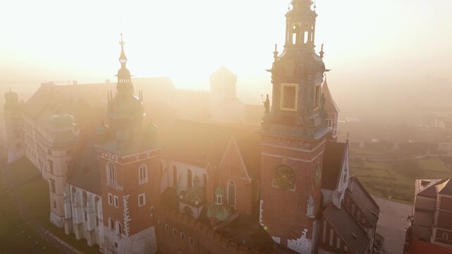 Aerial view of Wawel Castle during foggy sunrise, Krakow, Poland