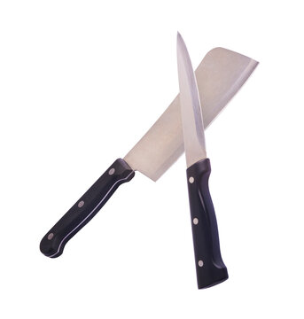 Levitating crossed heavy meat cleaver and utility knife with black handles isolated on a white background. Creative zero gravity concept.