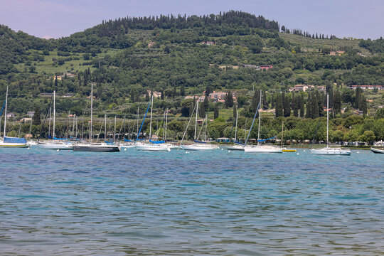  Yachts and motorboats moored in Bardolino on Lake Garda, Veneto, Italy