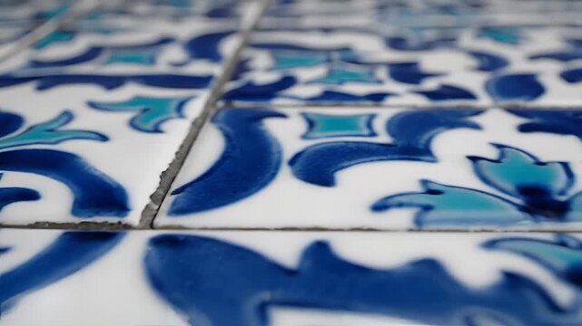 Closeup of Traditional Blue and White Ceramic Tiles with Intricate Patterns.