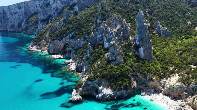 Aerial view of Cala Goloritz&egrave;, Baunei Coast, Sardinia, Italy. Iconic turquoise waters, white limestone cliffs adn pristine beach, often ranked among the most beautiful beaches in the world