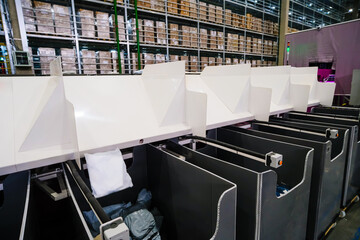 Busy warehouse interior with conveyor belts.