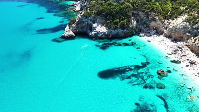 Aerial view of Cala Goloritz&egrave;, Baunei Coast, Sardinia, Italy. Iconic turquoise waters, white limestone cliffs adn pristine beach, often ranked among the most beautiful beaches in the world