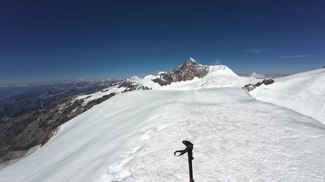 Pan shot of mountain glacier panorama with summits Gran Paradiso, Mont Blanc massif, Lyskamm, Weisshorn, Corno Nero (Schwarzhorn) and Parrotspitze in Pennine Alps, Italy