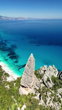 Aerial view of Cala Goloritz&egrave;, Baunei Coast, Sardinia, Italy. Iconic turquoise waters, white limestone cliffs adn pristine beach, often ranked among the most beautiful beaches in the world