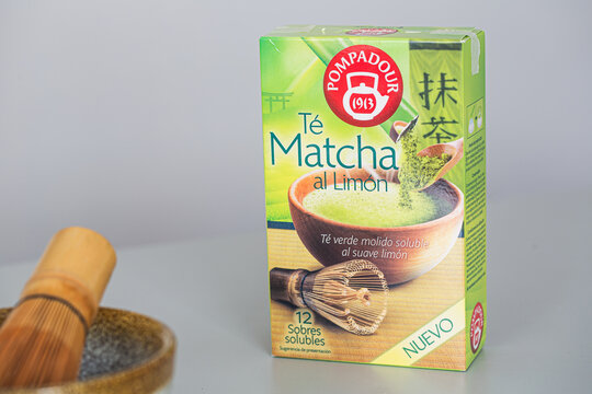 Alicante, Spain - April 25, 2026: Pompadour Matcha Tea with Lemon packaging displayed alongside a bamboo whisk and bowl on a light gray surface