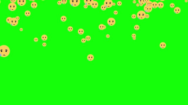 Yellow sad emojis drift across a vivid green screen