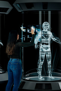 Engineer woman coding on holographic interface in 3D laboratory