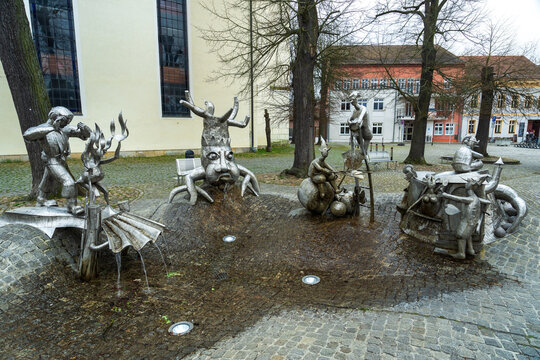 Modern metal sculpture fountain depicting local Sorbian folklore and legends in the historic market square of L&uuml;bbenau, near Lehde in the Spreewald region, Germany.