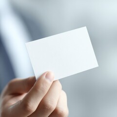 Fototapeta premium Professional hands offering blank business card for branding, marketing and contact exchange concept