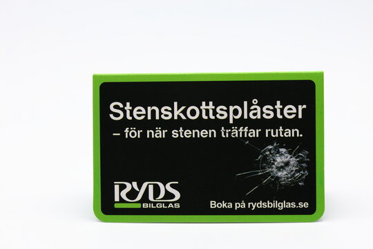 Bandage for stone chip damages at car windshield. Easy fix. From Ryds bilglas. Swedish text. White background.