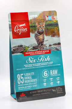 Orijen Six Fish cat food package with turquoise design closeup.