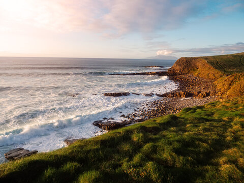 Castle Classiebawn viewpoint and stunning rough Irish stone coastline at sunset. Popular tourist area with amazing nature scenery. County Sligo, Ireland. Travel and tourism landmark.