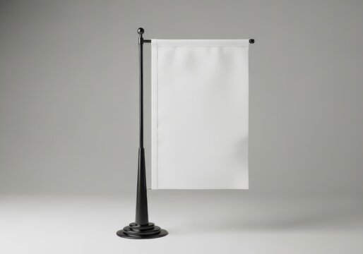 Blank white vertical desk flag mockup on a black metal stand