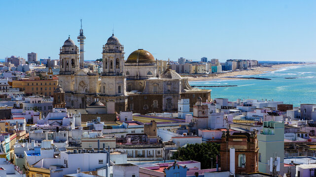 Cadiz Cathedral and city skyline with Atlantic coast, panoramic view of Cadiz Spain with beach and copy space