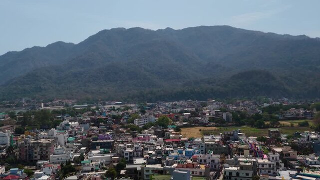 Upward aerial view showing houses and ganga river in rishikesh  