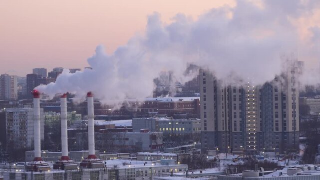 Urban industrial landscape with heavy smoke emissions from factory chimneys, highlighting environmental pollution, climate impact, and industrialization consequences, ideal for environmental awareness