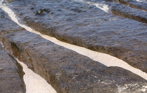 Gran Canaria, textures of the rocks of El Confital beach on the edge of Las Palmas de Gran Canaria, low tide
