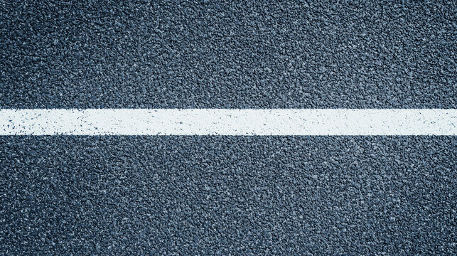 Close-up of a textured asphalt road surface with a single white painted line running horizontally across it.