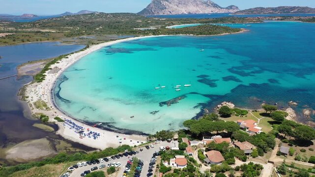Spiaggia di Lu Impostu 4K Aerial View of Cala Brandinchi SARDINIA  , Lu Impostu Bays. Cinematic aerial Drone Flight over Little Tahiti Turquoise Sea and White Sand. San Teodoro  top of Sardegena beach