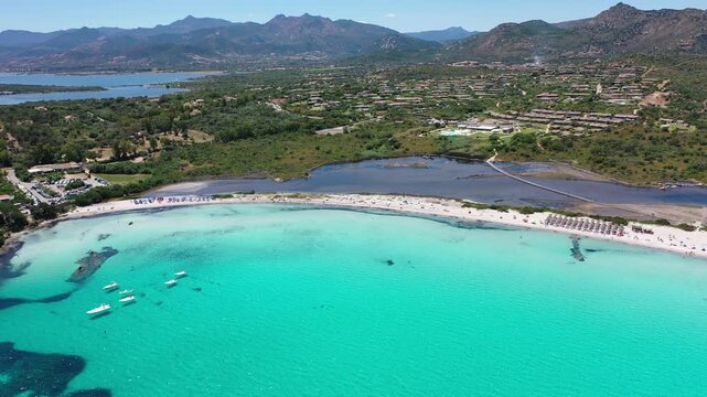 Spiaggia di Lu Impostu 4K Aerial View of Cala Brandinchi SARDINIA  , Lu Impostu Bays. Cinematic aerial Drone Flight over Little Tahiti Turquoise Sea and White Sand. San Teodoro  top of Sardegena beach