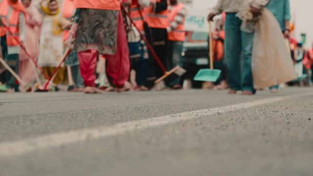 Indian Vaisakhi religious procession crowd people passes and street cleaning