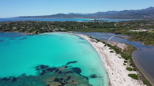 Spiaggia di Lu Impostu 4K Aerial View of Cala Brandinchi SARDINIA  , Lu Impostu Bays. Cinematic aerial Drone Flight over Little Tahiti Turquoise Sea and White Sand. San Teodoro  top of Sardegena beach