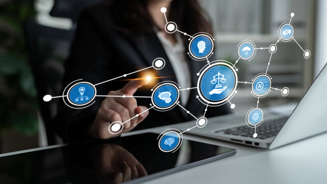 A professional woman interacts with digital legal icons in an office setting, representing the fusion of technology and law for innovative solutions and efficient services. Tessel