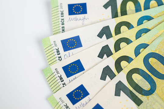 Arrangement emphasizing denomination and financial themes. Detailed presentation of one hundred euro banknotes highlighting wealth management visuals and denominations