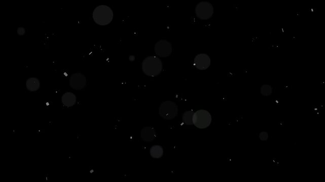 Soft ambient dust particles floating slowly creating beautiful bokeh light effect on dark background for overlay
