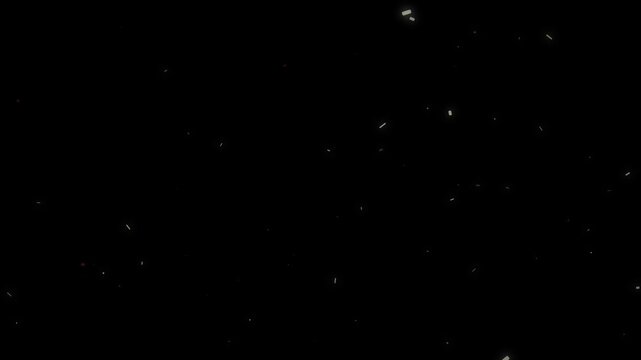 Atmospheric particles moving and floating slowly as glittering dust on a black background creating an ethereal mood