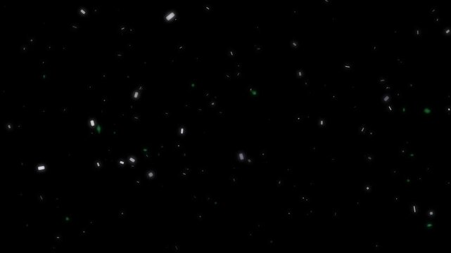 Atmospheric slow motion falling confetti particles with white and green elements creating an abstract movement