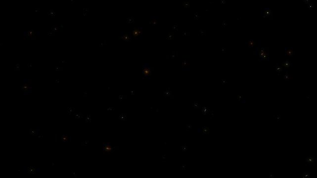 Movement of warm glowing fiery dust particles slowly rising and floating gracefully on a dark background
