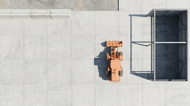 Aerial view of an orange construction vehicle driving on a rooftop next to a metal structure